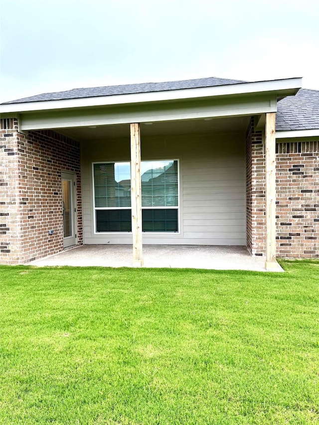 358 Frederick Dr, Robinson, TX 76706 - back of property with a patio, a lawn, and brick siding