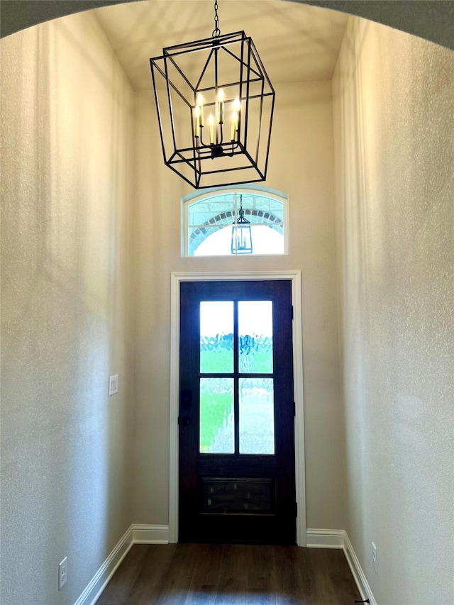 358 Frederick Dr, Robinson, TX 76706 - foyer with plenty of natural light, dark wood-style flooring, a chandelier, and baseboards
