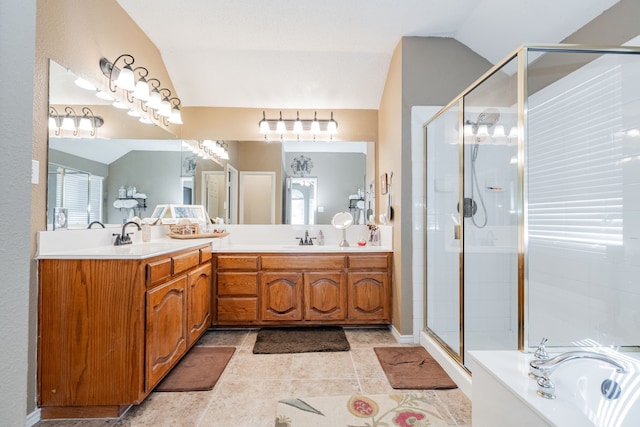 796 Ridge Rd W, Rockwall, TX 75087 - bathroom with vaulted ceiling, double vanity, a shower stall, and a garden tub