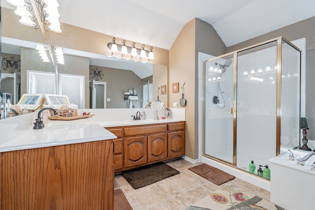 796 Ridge Rd W, Rockwall, TX 75087 - bathroom featuring double vanity, a shower stall, vaulted ceiling, a chandelier, and tile patterned flooring