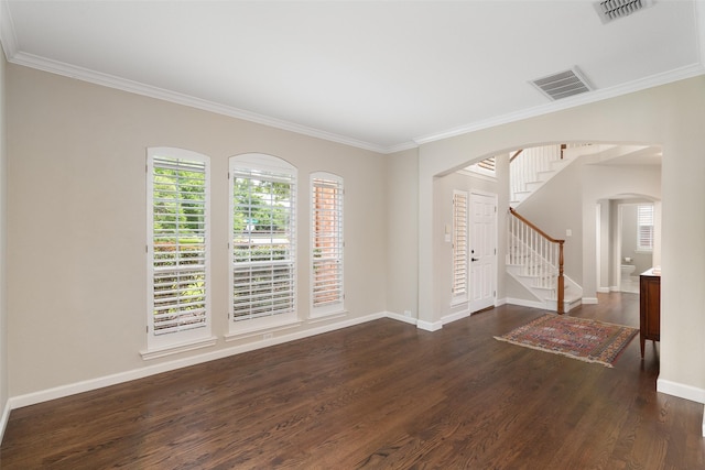 1405 San Mateo Dr, Allen, TX 75013 - empty room with arched walkways, dark wood finished floors, ornamental molding, stairs, and baseboards