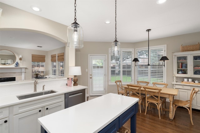 1405 San Mateo Dr, Allen, TX 75013 - kitchen featuring a sink, stainless steel dishwasher, blue cabinets, light countertops, and dark wood-style floors