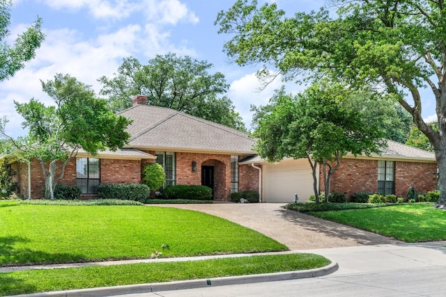 6737 Lake Shore Dr, Garland, TX 75044 - view of front of house featuring a garage, a front yard, a chimney, driveway, and brick siding