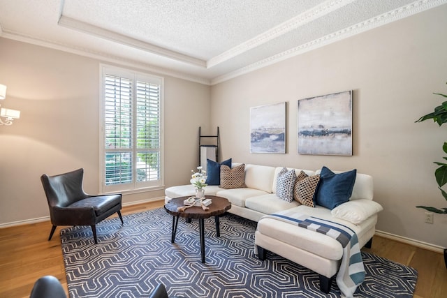 6737 Lake Shore Dr, Garland, TX 75044 - living area featuring ornamental molding, a tray ceiling, wood finished floors, and a textured ceiling