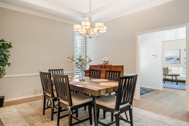 6737 Lake Shore Dr, Garland, TX 75044 - dining room featuring ornamental molding, light wood-style floors, a chandelier, and a raised ceiling