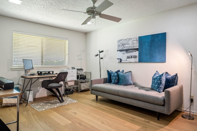 6737 Lake Shore Dr, Garland, TX 75044 - office featuring wood finished floors, a ceiling fan, and a textured ceiling