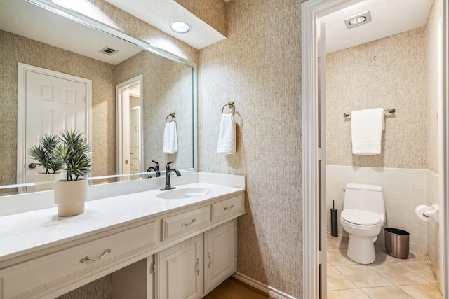 6737 Lake Shore Dr, Garland, TX 75044 - bathroom featuring vanity, wallpapered walls, and tile patterned floors