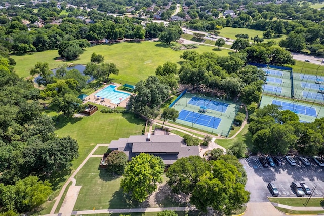 6737 Lake Shore Dr, Garland, TX 75044 - drone / aerial view of a pool and a tree filled landscape