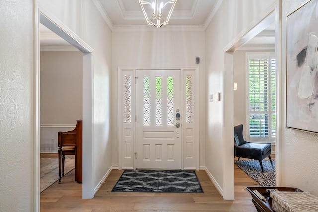 6737 Lake Shore Dr, Garland, TX 75044 - entryway with wood finished floors, a chandelier, and crown molding