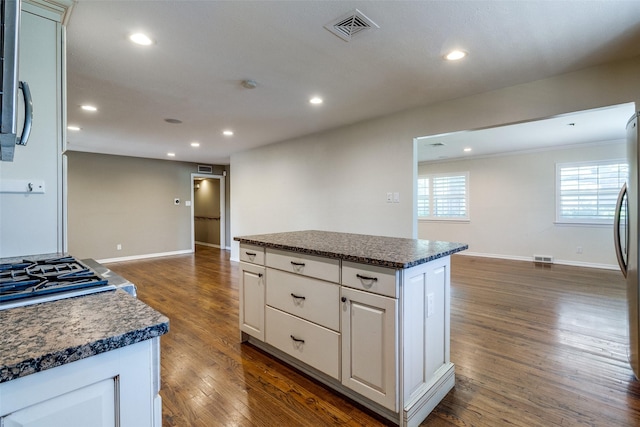 3635 Merrell Rd, Dallas, TX 75229 - kitchen with dark countertops, recessed lighting, dark wood-style flooring, baseboards, and open floor plan