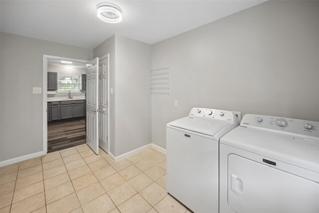 2144 County Road 4535, Whitewright, TX 75491 - washroom featuring independent washer and dryer, baseboards, and light tile patterned floors