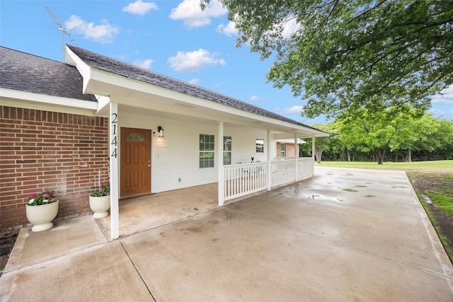 2144 County Road 4535, Whitewright, TX 75491 - view of side of home featuring brick siding