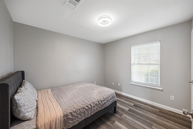 2144 County Road 4535, Whitewright, TX 75491 - bedroom with dark wood-style flooring and baseboards