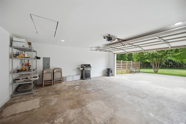 2144 County Road 4535, Whitewright, TX 75491 - garage featuring electric panel, a garage door opener, and recessed lighting