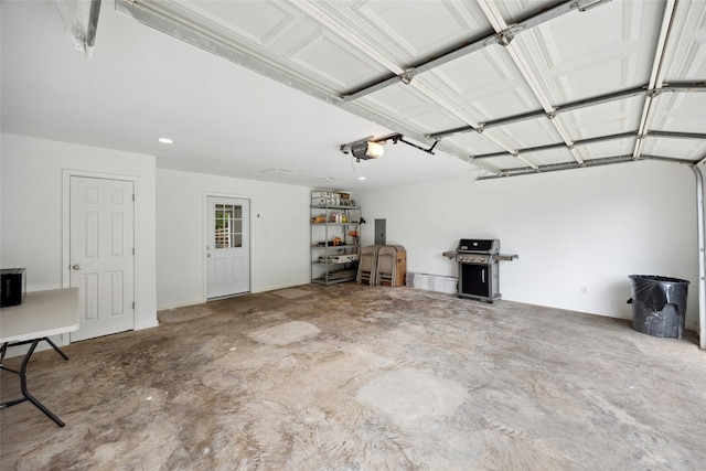 2144 County Road 4535, Whitewright, TX 75491 - garage featuring a garage door opener and recessed lighting