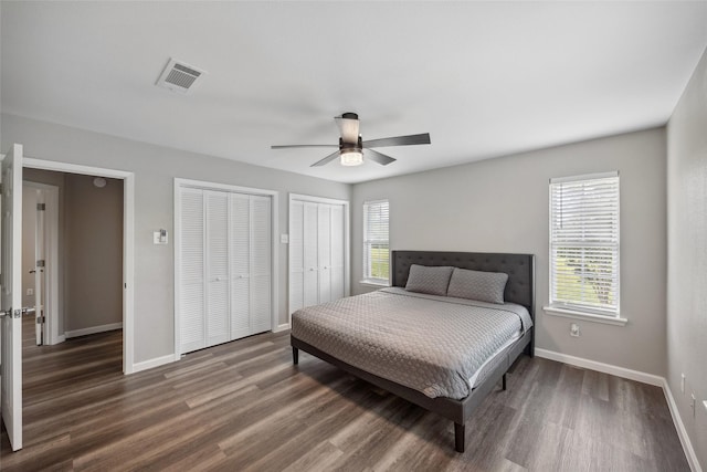2144 County Road 4535, Whitewright, TX 75491 - bedroom with multiple windows, wood finished floors, two closets, and baseboards