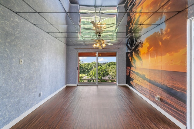 7317 E Fm 917, Alvarado, TX 76009 - empty room with wood finished floors, baseboards, and a ceiling fan