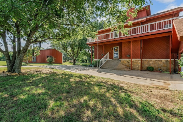 7317 E Fm 917, Alvarado, TX 76009 - back of property with a yard and stone siding
