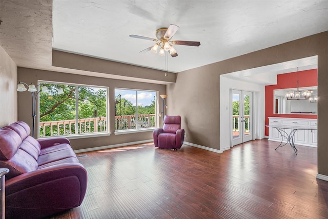 7317 E Fm 917, Alvarado, TX 76009 - living room with healthy amount of natural light, a chandelier, wood finished floors, and a ceiling fan