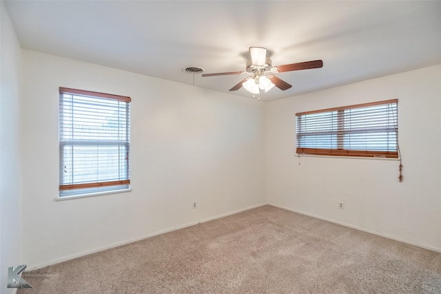 25 Spears Cir, Abilene, TX 79601 - spare room featuring light carpet, ceiling fan, and baseboards