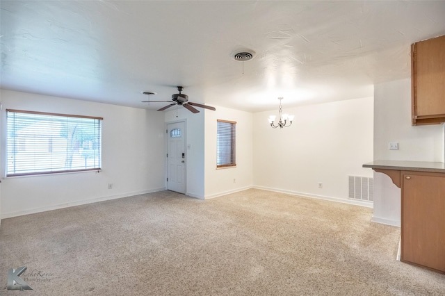 25 Spears Cir, Abilene, TX 79601 - unfurnished living room with a chandelier, light carpet, ceiling fan, and baseboards