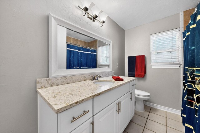 5405 Westhaven Dr, Fort Worth, TX 76132 - full bathroom with vanity, tile patterned flooring, toilet, baseboards, and a shower with curtain