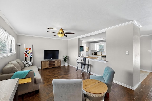 5405 Westhaven Dr, Fort Worth, TX 76132 - living room with ornamental molding, a ceiling fan, dark wood-style floors, and healthy amount of natural light