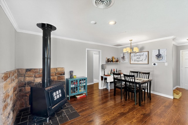 5405 Westhaven Dr, Fort Worth, TX 76132 - dining area featuring crown molding, baseboards, wood finished floors, a chandelier, and a wood stove
