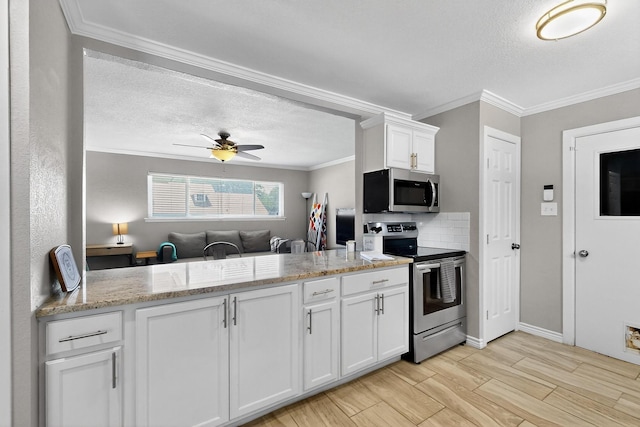 5405 Westhaven Dr, Fort Worth, TX 76132 - kitchen featuring stainless steel appliances, a textured ceiling, ornamental molding, white cabinetry, and a ceiling fan