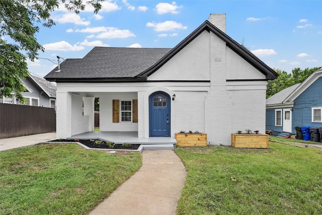 1608 N 17th St, Waco, TX 76707 - view of front of property with a porch, a chimney, brick siding, and roof with shingles