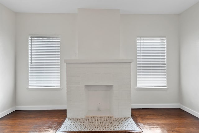1608 N 17th St, Waco, TX 76707 - unfurnished living room with wood finished floors and baseboards