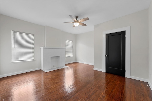 1608 N 17th St, Waco, TX 76707 - unfurnished living room with ceiling fan, wood finished floors, baseboards, and a fireplace