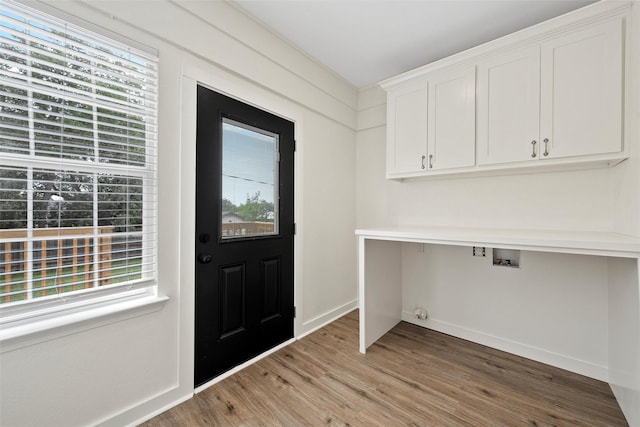 1608 N 17th St, Waco, TX 76707 - entryway with healthy amount of natural light, light wood-style flooring, and baseboards