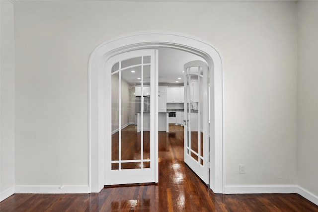 1608 N 17th St, Waco, TX 76707 - detailed view of arched walkways, wood finished floors, recessed lighting, and baseboards