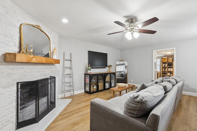 559 Bell Dr, Allen, TX 75002 - living room with a ceiling fan, a fireplace, wood finished floors, and baseboards