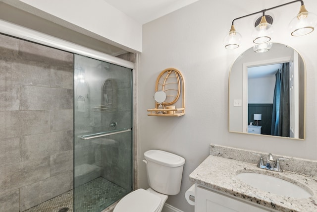 559 Bell Dr, Allen, TX 75002 - bathroom with vanity, toilet, tiled shower, and baseboards