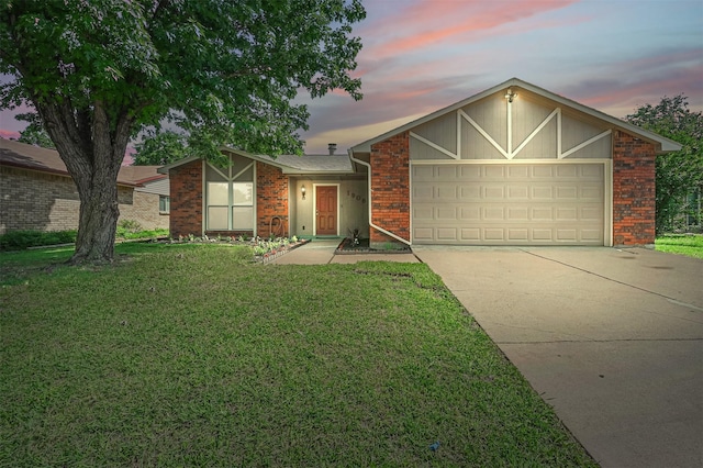1908 Rutherford Ln, Arlington, TX 76014 - view of front of property featuring concrete driveway, a garage, brick siding, and a front yard