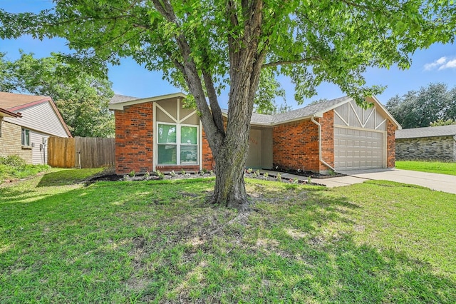 1908 Rutherford Ln, Arlington, TX 76014 - view of front of property featuring an attached garage, concrete driveway, and brick siding