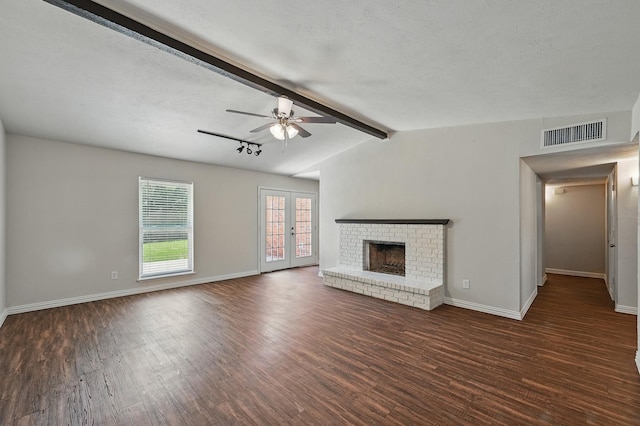 1908 Rutherford Ln, Arlington, TX 76014 - unfurnished living room featuring wood finished floors, a ceiling fan, a brick fireplace, and baseboards