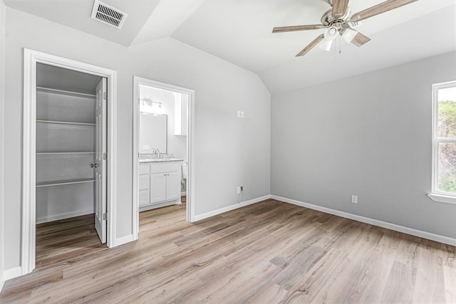 915 Comanche Cove Dr, Granbury, TX 76048 - unfurnished bedroom with vaulted ceiling, a spacious closet, a closet, light wood finished floors, and baseboards