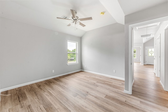 915 Comanche Cove Dr, Granbury, TX 76048 - empty room with attic access, vaulted ceiling, ceiling fan, baseboards, and light wood finished floors