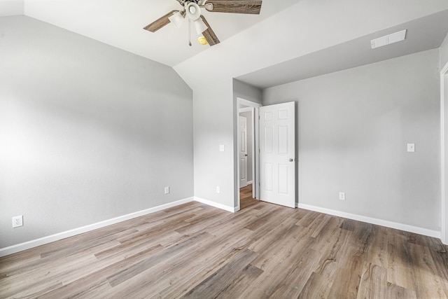 915 Comanche Cove Dr, Granbury, TX 76048 - unfurnished bedroom featuring lofted ceiling, wood finished floors, baseboards, and a ceiling fan