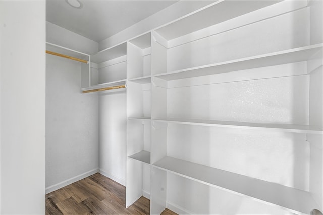 915 Comanche Cove Dr, Granbury, TX 76048 - walk in closet with wood finished floors