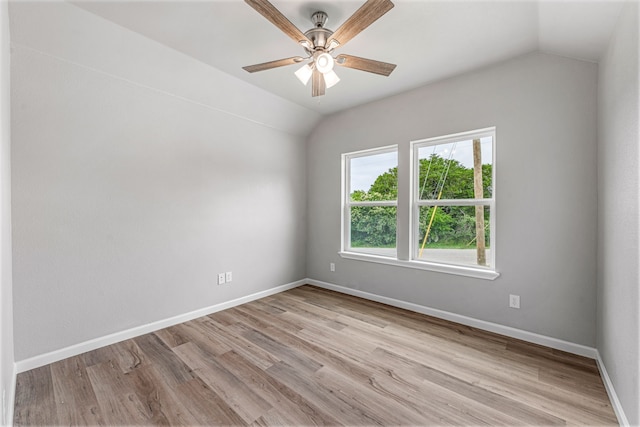 915 Comanche Cove Dr, Granbury, TX 76048 - spare room with vaulted ceiling, light wood-style floors, ceiling fan, and baseboards