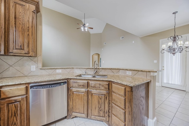 7605 Chief Spotted Tail Dr, Mckinney, TX 75070 - kitchen with stainless steel dishwasher, a sink, light tile patterned floors, a peninsula, and brown cabinets
