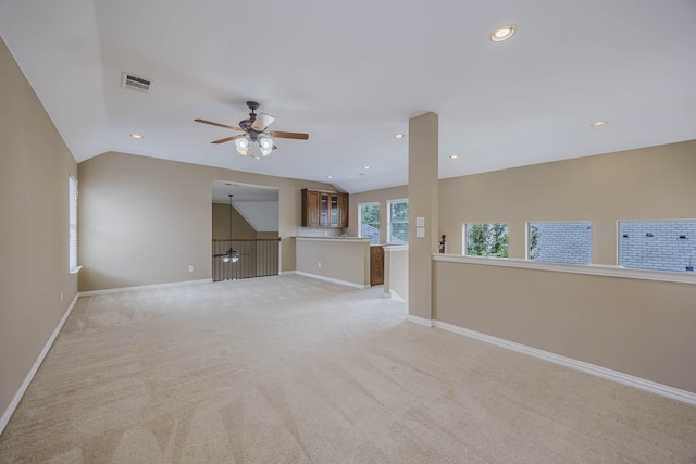7605 Chief Spotted Tail Dr, Mckinney, TX 75070 - unfurnished living room featuring vaulted ceiling, baseboards, light colored carpet, ceiling fan, and recessed lighting