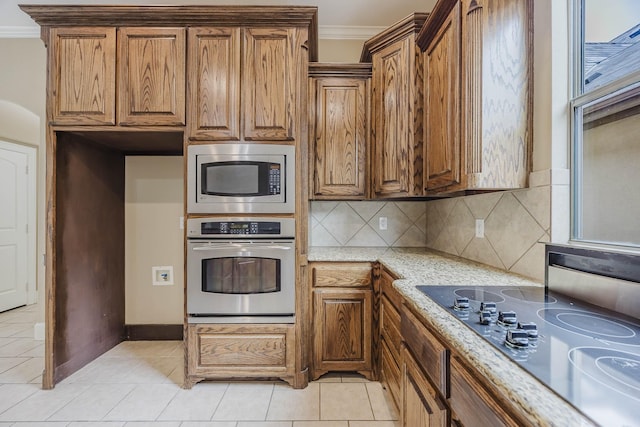 7605 Chief Spotted Tail Dr, Mckinney, TX 75070 - kitchen featuring stainless steel appliances, ornamental molding, light stone countertops, tasteful backsplash, and light tile patterned floors