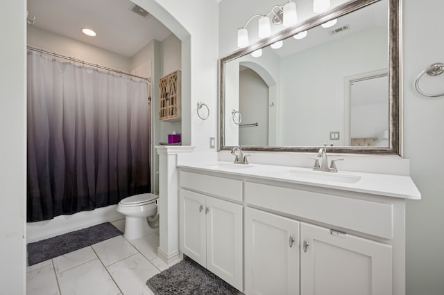 4213 Tallulah Dr, Plano, TX 75074 - full bathroom with double vanity, toilet, marble look tiles, and shower / bath combo
