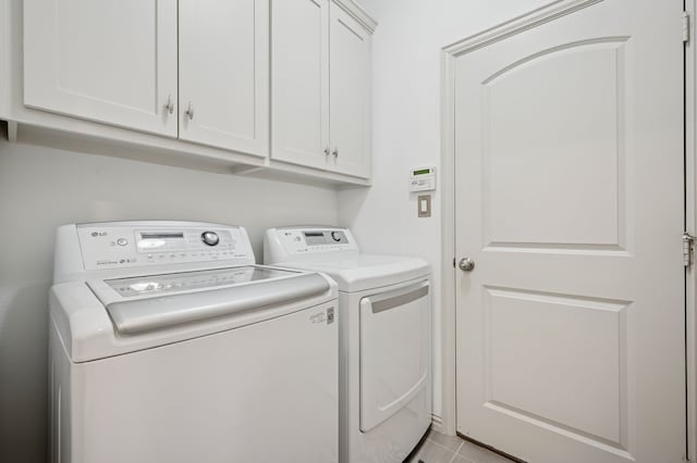 4213 Tallulah Dr, Plano, TX 75074 - laundry room featuring washer and clothes dryer and cabinet space
