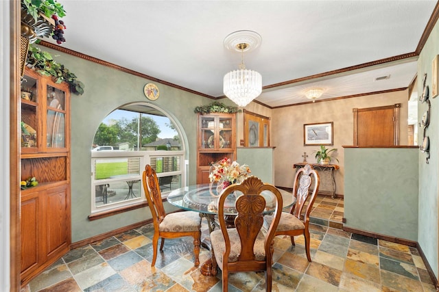 2514 Good Shepherd Dr, Brownwood, TX 76801 - dining area featuring stone tile floors, baseboards, a chandelier, and ornamental molding